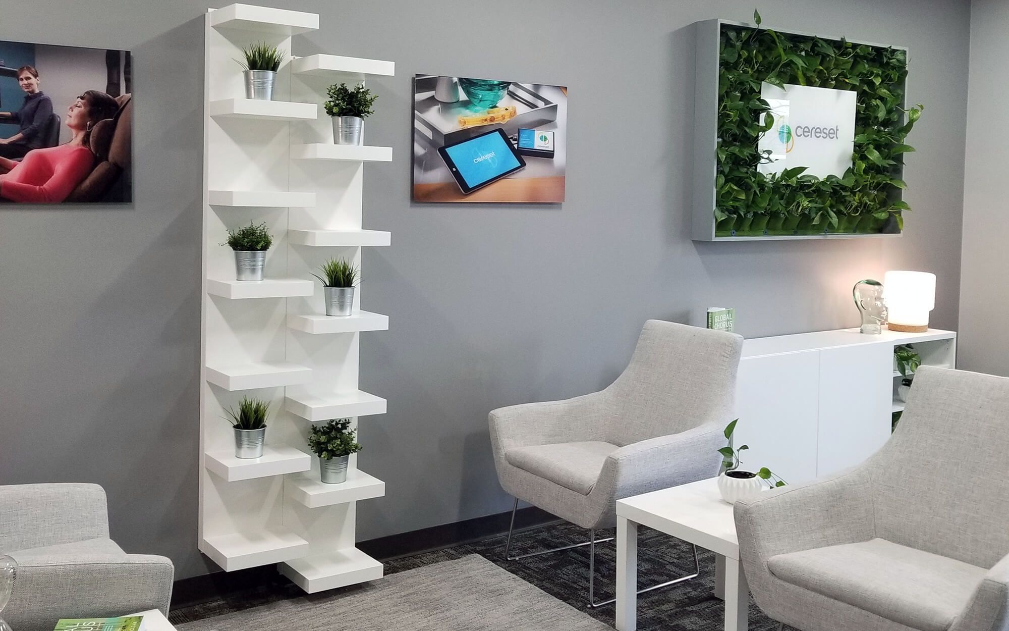 Inside the Cereset Carmel studio: soft seating, warm light, and a living plant wall